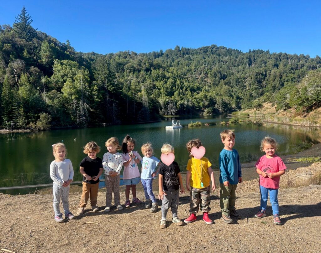 Wilderness Cubs children gathered beside a lake